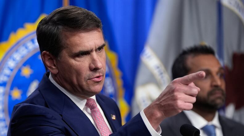 Acting Attorney General Todd Blanche speaks as FBI director Kash Patel speaks during a news conference at the Department of Justice, Wednesday, July 1, 2026 in Washington. (AP Photo/Manuel Balce Ceneta)