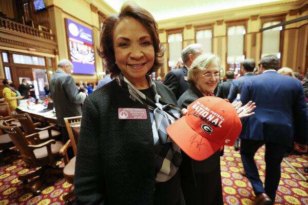 State Rep. Miriam Paris showed off a Georgia Bulldogs hat signed by coach Kirby Smart at the Capitol in Atlanta in 2022.