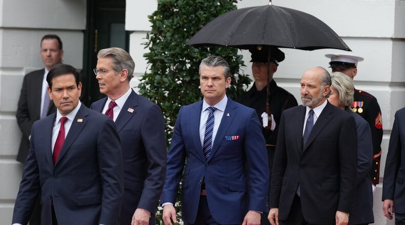 From left, Secretary of State, Marco Rubio, Treasury Secretary Scott Bessent, Secretary of Defense Pete Hegseth and Commerce Secretary Howard Lutnick, arrive before President Donald Trump and first lady Melania Trump greet Britain's King Charles III and Queen Camilla during a State Visit arrival ceremony on the South Lawn of the White House, Tuesday, April 28, 2026, in Washington. (AP Photo/Mark Schiefelbein)