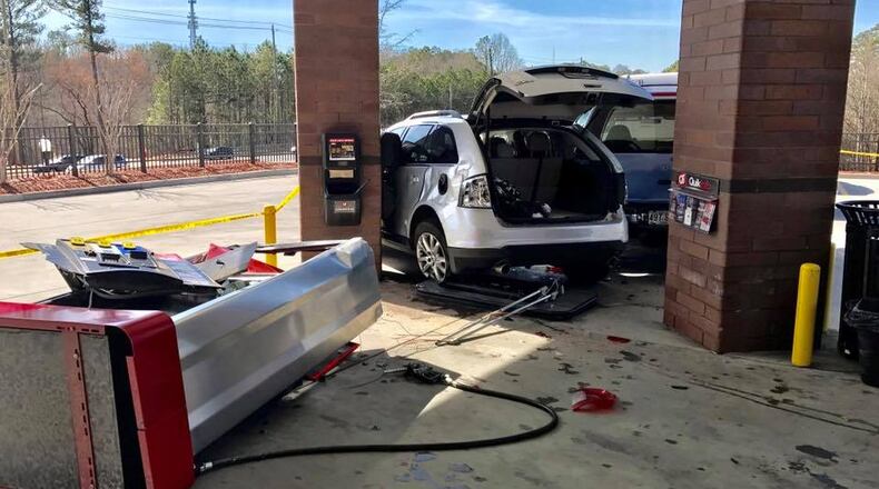 A gas pump at an Alpharetta QuikTrip was knocked over after a crash involving two SUVs, police said. (Credit: Alpharetta Department of Public Safety)
