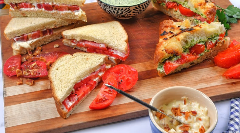 Put a new spin on an old summer favorite with Heirloom Tomato Sandwich with Bacon Mayonnaise (left side upper), Improved Classic Tomato Sandwich (left side lower) and Grilled Tomato and Chimichurri Sandwich (right side). (Styling by Kate Williams / Chris Hunt for the AJC)