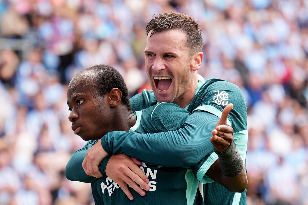Brighton and Hove Albion's Malick Yalcouye, left, celebrates with Pascal Gross after scoring their side's second goal of the game during the English Premier League soccer match between Coventry City and Brighton and Hove Albion in Coventry, England, Sunday Sept. 13, 2026. (Mike Egerton/PA via AP)