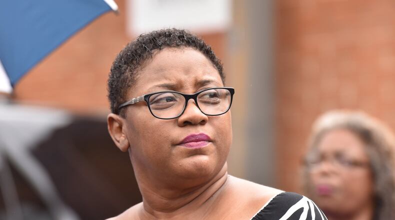 Tamara Cotman, who was convicted in the Atlanta Public Schools test-cheating case, reacts before she turns herself in outside the Fulton County Jail in Atlanta on Tuesday, October 9, 2018. AJC file photo. HYOSUB SHIN / HSHIN@AJC.COM