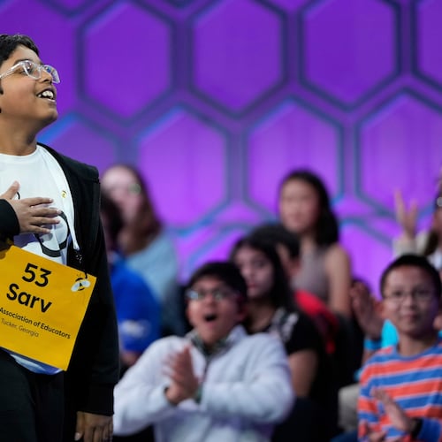 FILE - Sarv Dharavane, 11, of Tucker, Ga., reacts after spelling his word correctly in the finals of the Scripps National Spelling Bee, Thursday, May 29, 2025, in Oxon Hill, Md. (AP Photo/Julia Demaree Nikhinson, File)