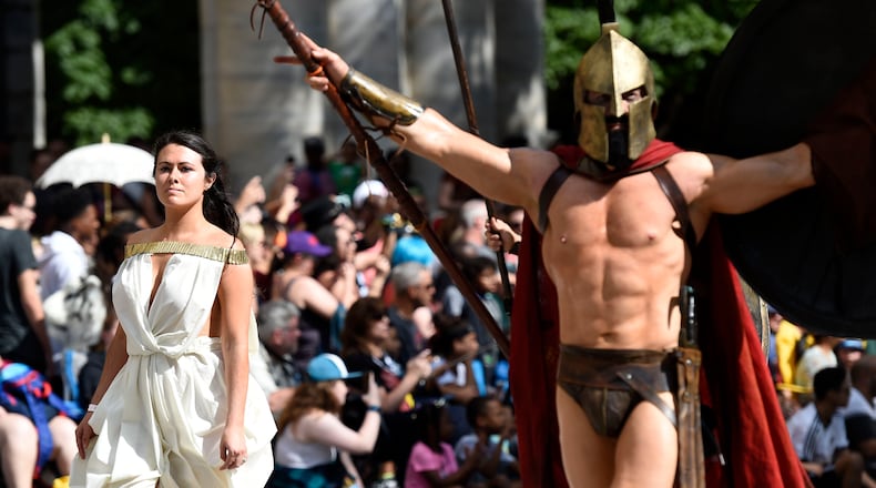 Cosplayers dressed as Queen Gorgo and King Leonidas I, left to right, walk down Peachtree Street at the annual Dragon Con Parade on  Saturday, Sept. 1, 2018, in Atlanta. (Photo: Jenna Eason / Jenna.Eason@coxinc.com)