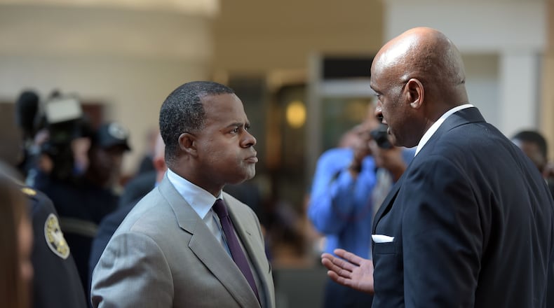 Miguel Southwell (right) talks with Atlanta Mayor Kasim Reed in friendlier times. Kent D. Johnson, kdjohnson@ajc.com