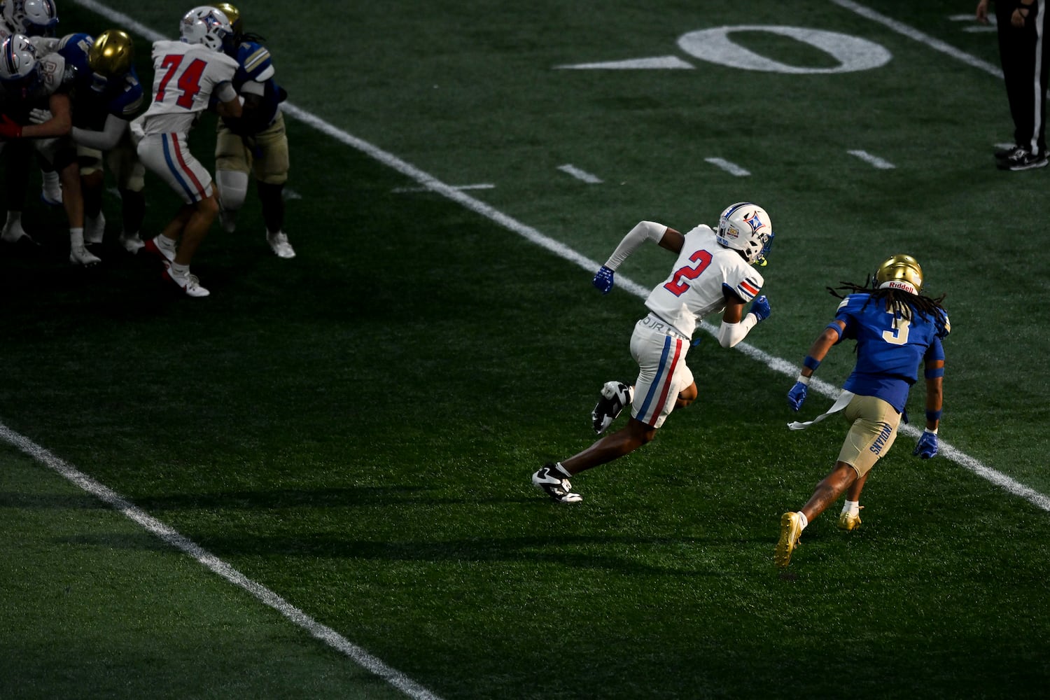Walton cornerback Caden Young (2) and McEachern defensive back Kiyante’ Ingram (3) take off from the line of scrimmage during the second half of the Corky Kell Classic football game Saturday, August 16, 2025 at the Mercedes-Benz Stadium. (Daniel Varnado/For the Atlanta Journal-Constitution)