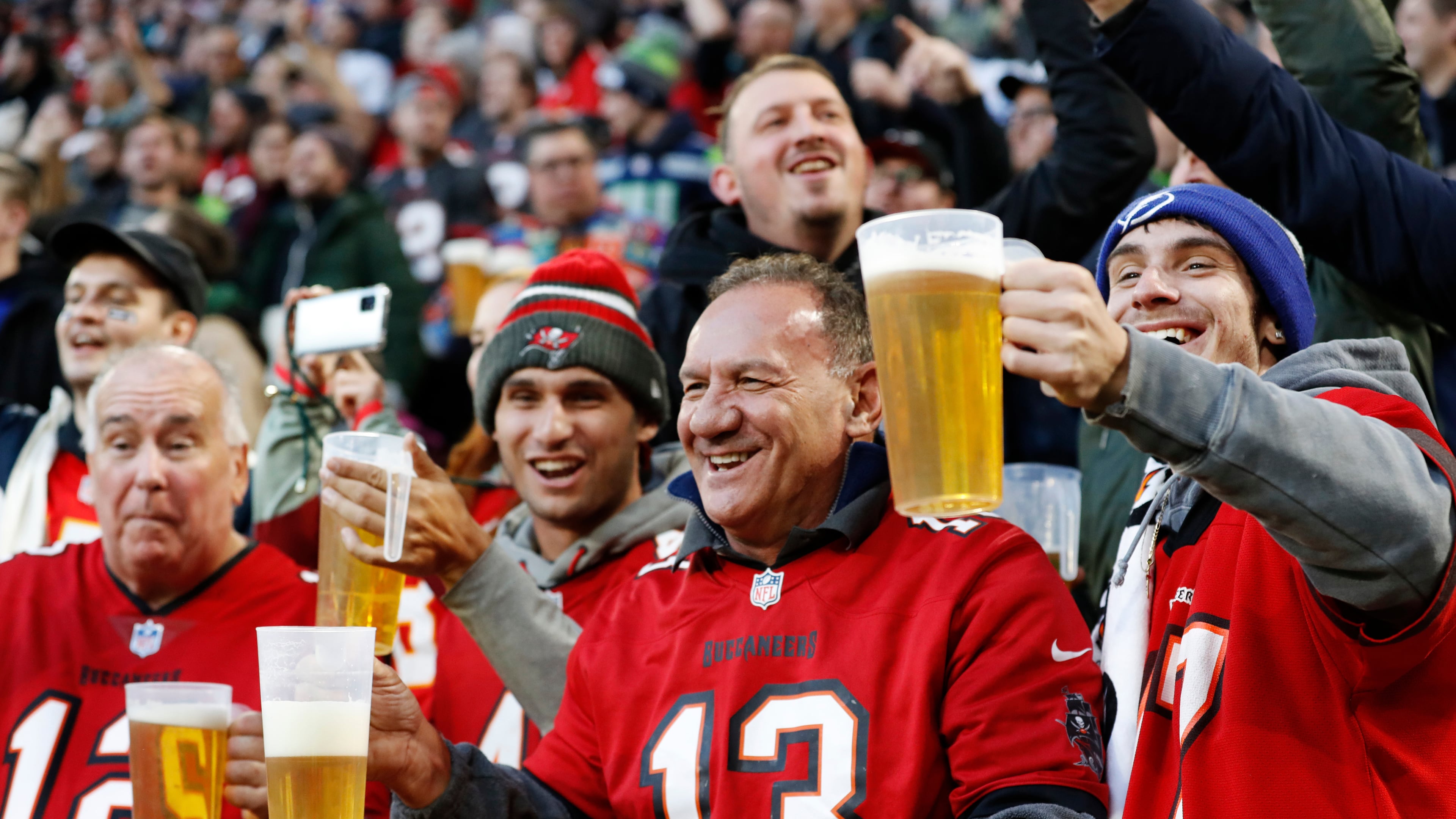 FILE - Fans cheer during an NFL football game between the Tampa Bay Buccaneers and the Seattle Seahawks at Allianz Arena in Munich, Germany, Nov. 13, 2022. (AP Photo/Steve Luciano, File)