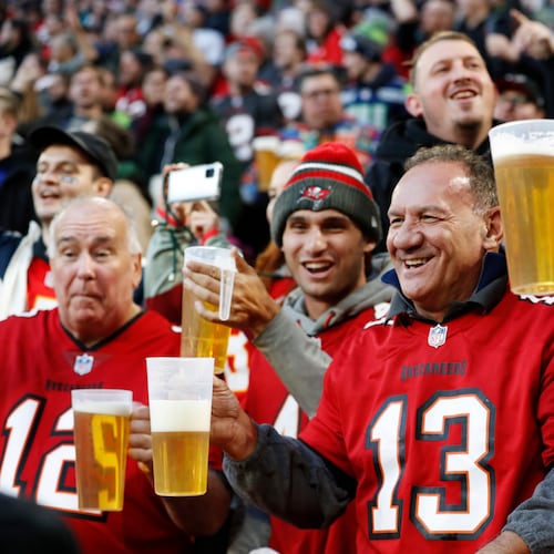 FILE - Fans cheer during an NFL football game between the Tampa Bay Buccaneers and the Seattle Seahawks at Allianz Arena in Munich, Germany, Nov. 13, 2022. (AP Photo/Steve Luciano, File)
