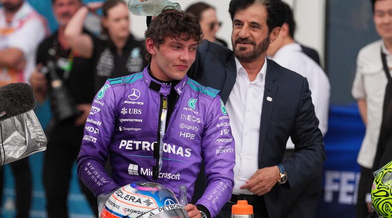 Mohammed Ben Sulayem President of the Federation Internationale de l'Automobile (FIA) pours water on the head of Mercedes driver Kimi Antonelli of Italy after Antonelli won the Miami Formula One Grand Prix auto race, Sunday, May 3, 2026, in Miami Gardens, Fla. (AP Photo/Rebecca Blackwell)