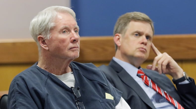 The trial of Claud “Tex” McIver (left) has been delayed until March. Here, McIver is seated next to one of his attorneys, Joe Sharp, during a pretrial motion. BOB ANDRES /BANDRES@AJC.COM