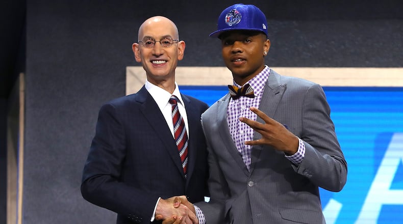 Markelle Fultz walks on stage with NBA commissioner Adam Silver after being drafted first overall by the Philadelphia 76ers during the first round of the 2017 NBA Draft at Barclays Center on June 22, 2017 in New York City. (Photo by Mike Stobe/Getty Images)