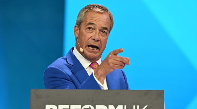 Reform Party Leader Nigel Farage points as he speaks during the Reform party's annual conference at the National Exhibition Centre in Birmingham, England, Friday, Sept. 4, 2026. (AP Photo/Thomas Krych)