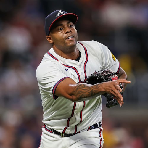 FILE- Atlanta Braves pitcher Raisel Iglesias throws to first base in the eighth inning of a baseball game against the Milwaukee Brewers, Aug. 6, 2025, in Atlanta. (AP Photo/Colin Hubbard, File)