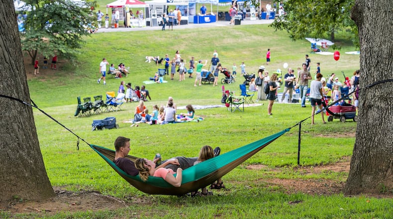 The giant trees in Grant Park offer relief from the heat during the annual Summer Shade Festival which has live music, food and children’s activities.