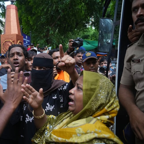 Protesters confront a police officer during a demonstration demanding educational reforms as part of the Cockroach Janta Party's ongoing protest movement in Mumbai, India, Thursday, July 23, 2026. (AP Photo/Rafiq Maqbool)