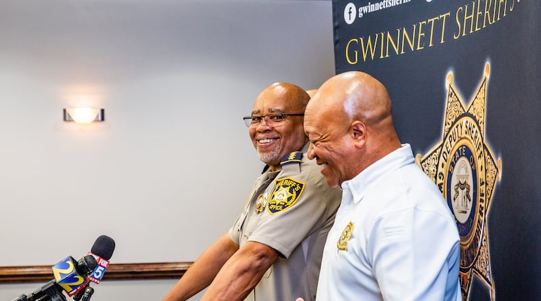 Gwinnett County Sheriff Keybo Taylor, left, addresses the press at the Gwinnett Sheriff's Office in Lawrenceville with Cobb County Sheriff Craig Owens, right, at his side on Tuesday, June 29, 2021.  Sheriff Taylor addresses an extortion lawsuit against him initiated by staff at a bail bonds company which has concluded, the bond service has retracted the lawsuit.  (Jenni Girtman for The Atlanta Journal-Constitution