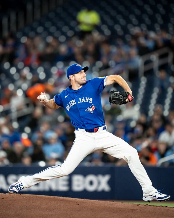 Toronto Blue Jays pitcher Max Scherzer (31) throws during the first inning of baseball game against the Baltimore Orioles Saturday, March 29, 2025, in Toronto. (Christopher Katsarov/The Canadian Press via AP)