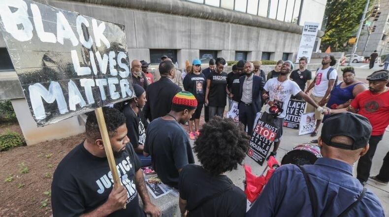 A 24-hour protest at the Fulton County Justice Center at 395 Pryor St SW, in last summer in Atlanta was aimed at bringing attention to the number of black men killed by police. JOHN SPINK /JSPINK@AJC.COM