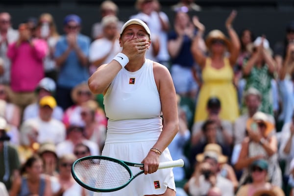 Amanda Anisimova of the U.S. celebrates winning the women's singles semifinal match against Aryna Sabalenka of Belarus at the Wimbledon Tennis Championships in London, Thursday, July 10, 2025.(AP Photo/Kirsty Wigglesworth)