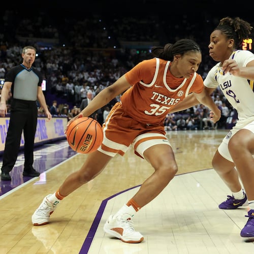 Texas forward Madison Booker (35) tries to drive past LSU guard Mikaylah Williams (12) in the first half of an NCAA college basketball game in Baton Rouge, La., Sunday, Jan. 11, 2026. (AP Photo/Peter Forest)