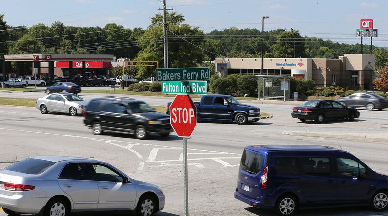 A vibrant flow of traffic passes by a gas station and a bank at the intersection of Fulton Industrial Boulevard at Bakers Ferry Road. Atlanta and South Fulton are sparring about annexing the last unincorporated area in the county, on Fulton Industrial Boulevard. Curtis Compton /ccompton@ajc.com AJC FILE PHOTO