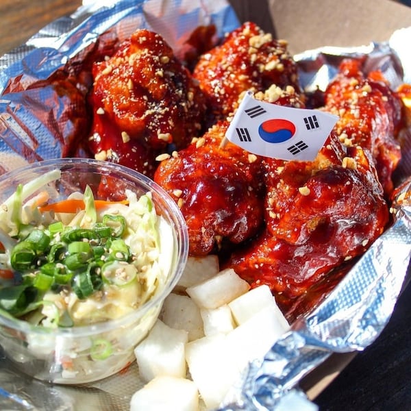 Seoul Chikin’s yangnyeom wings (shown with pickled radish and a side of garlic Kewpie slaw) are available at Smith’s Olde Bar on Fridays. Courtesy of Seoul Chikin