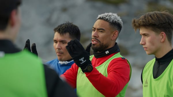 Patrick Frederiksen, captain of Greenland's national team, speaks to players during the training at Nuuk stadium in Nuuk, Greenland, Tuesday, June 17, 2025. (AP Photo/Kwiyeon Ha)