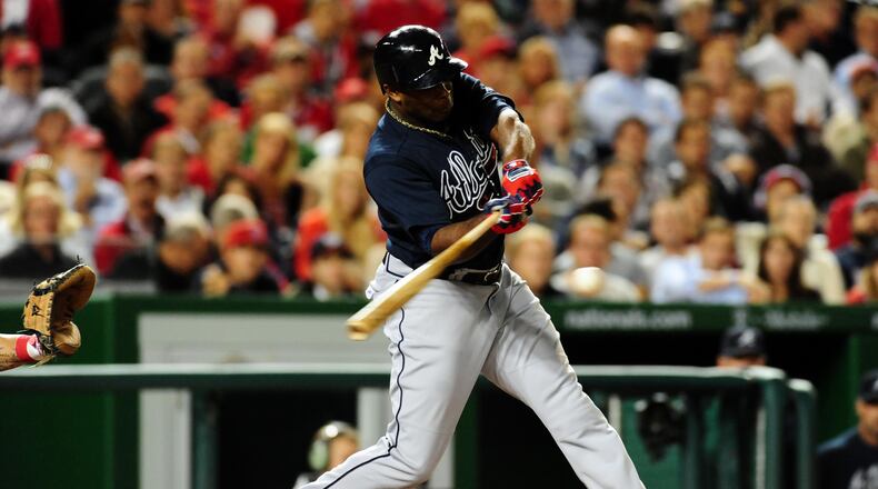 Sep 18, 2013; Washington, DC, USA; Atlanta Braves outfielder Justin Upton (8) singles in the fourth inning against the Washington Nationals at Nationals Park. Mandatory Credit: Evan Habeeb-USA TODAY Sports