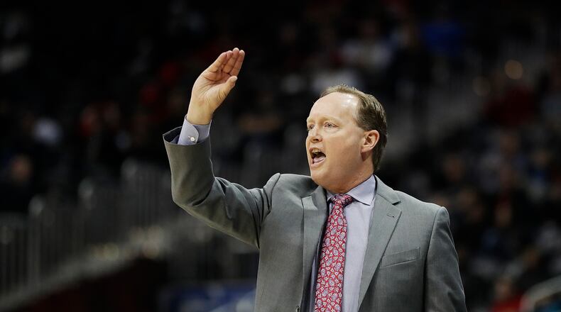 Atlanta Hawks head coach Mike Budenholzer stands on the sideline in the first quarter of an NBA basketball game against the Orlando Magic in Atlanta, Tuesday, Dec. 13, 2016. (AP Photo/David Goldman)