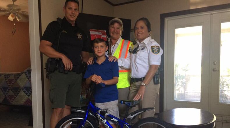 Nichols Murray and his new bike, gifted to him from his school crossing guard and the Martin County Sheriff’s Office.