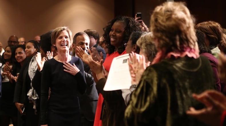 Former Acting Attorney General Sally Yates enters the Carter Center auditorium amid cheers on Wednesday. (Henry Taylor / henry.taylor@ajc.com)