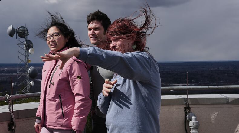 Amanda Joly, right, gives a tour to Naomi Jang, left, and Miles Abel, center, at the Blue Hill Observatory and Science Center, Saturday, March 14, 2026, in Milton, Mass. (Laura Martin Agudelo/MIT Graduate Program in Science Writing via AP)