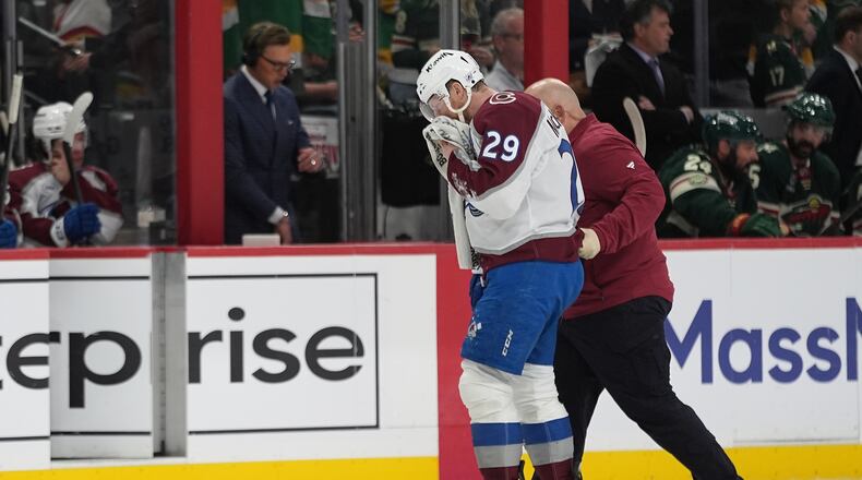 Colorado Avalanche center Nathan MacKinnon (29) leaves the ice during the second period of Game 4 in an NHL Stanley Cup hockey second-round playoff series against the Minnesota Wild Monday, May 11, 2026, in St. Paul, Minn. (AP Photo/Abbie Parr)