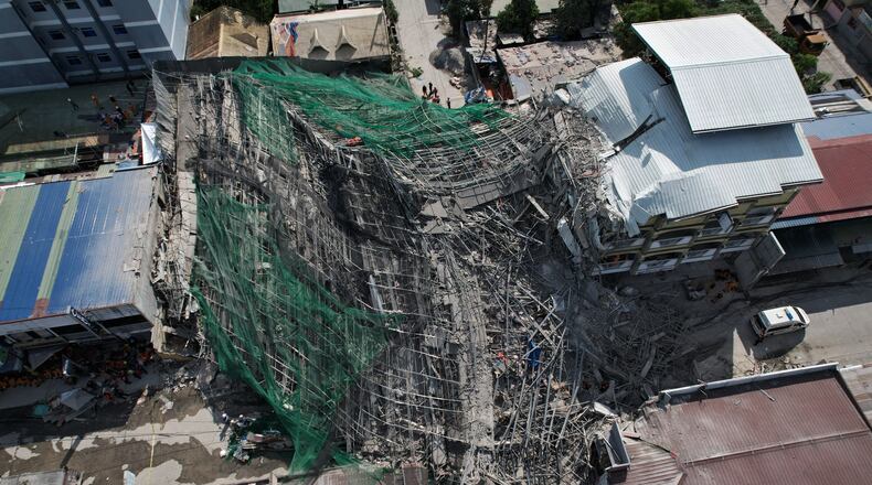 A collapsed building where multiple people are believed to be trapped in Angeles city in Pampanga province, north of Manila, Philippines Sunday, May 24, 2026. (AP Photo/Aaron Favila)