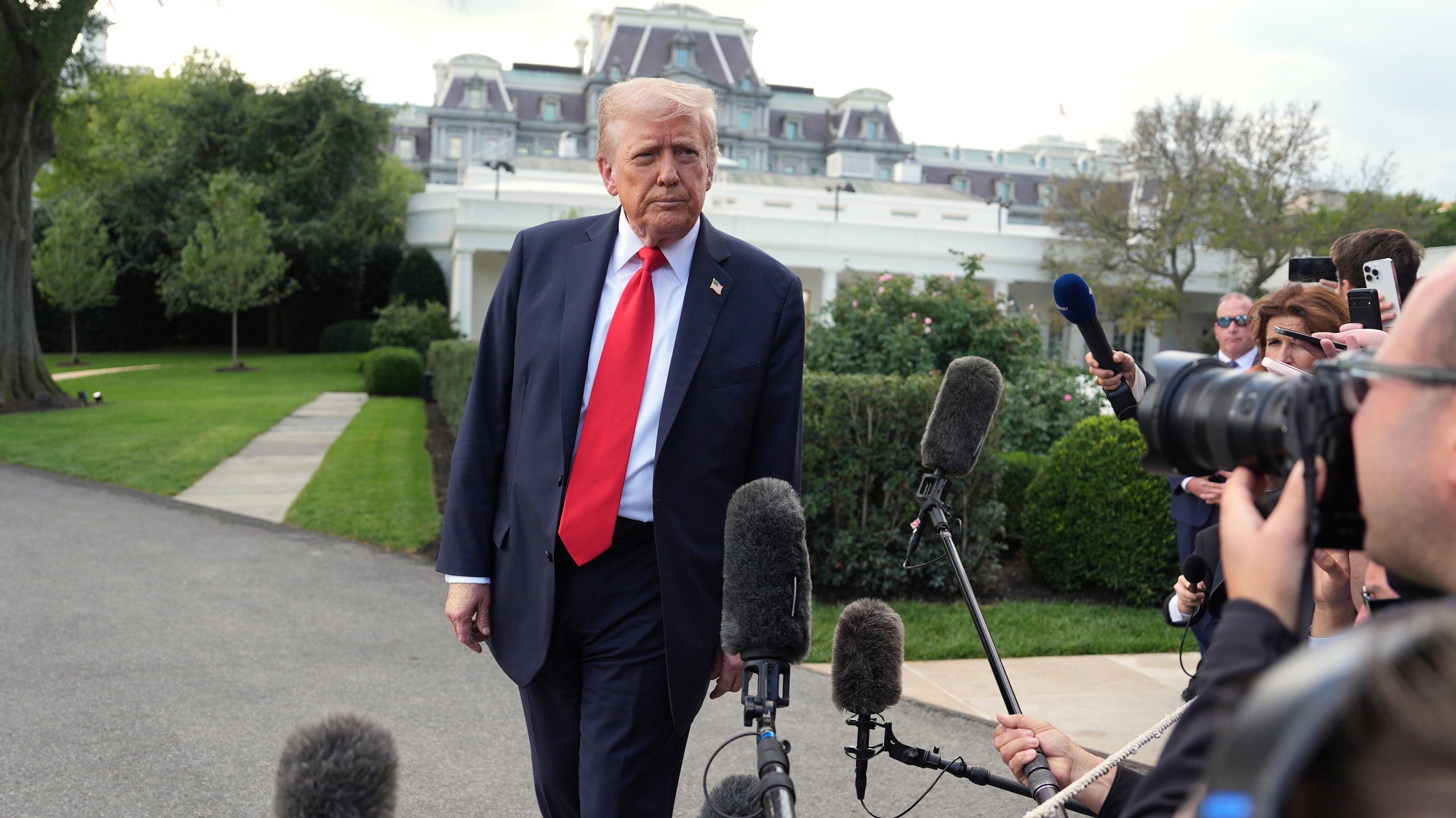 President Donald Trump speaks with reporters before boarding Marine One on the South Lawn of the White House, Thursday, Sept. 11, 2025, in Washington. (AP Photo/Evan Vucci)