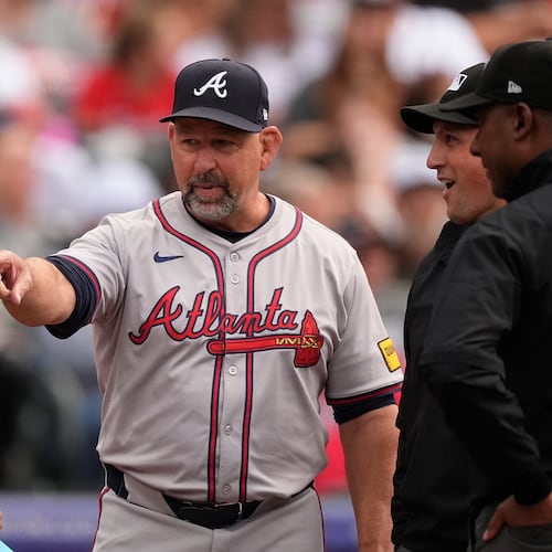 FILE - Atlanta Braves bench coach Walt Weiss, right, points to Colorado Rockies manager Bud Black before the first inning of a baseball game Aug. 9, 2024, in Denver. (AP Photo/David Zalubowski, File)