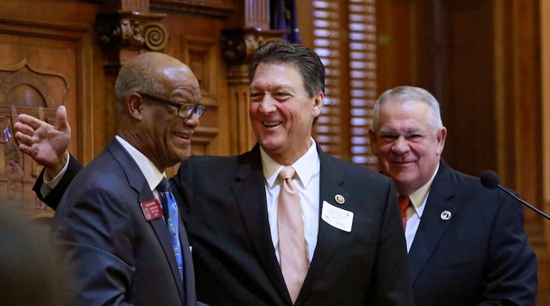 Jan. 14, 2016 -  Atlanta -  U.S. Rep. Lynn Westmoreland, who served in the Georgia House in 1993, was introduced by Rep. Calvin Smyre (left), D - Columbus, as a guest speaker, as Speaker of the House David Ralston looks on.   Westmoreland, who has announced he is not running for reelection to congress.   Activity in the House and Senate was mostly ceremonial today.  Deal administration officials (Chief of Staff Chris Riley and Office of Planning and Budget Director Theresa MacCartney) held a briefing on the FY17 budget and members of the Georgia House Democratic Caucus released it's  2016 legislative agenda.    BOB ANDRES  / BANDRES@AJC.COM