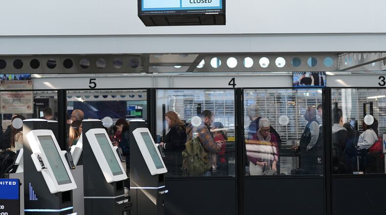 An information screen is displayed in Terminal 1 at O'Hare International Airport, in Chicago, Sunday, Feb. 15, 2026. (AP Photo/Nam Y. Huh)