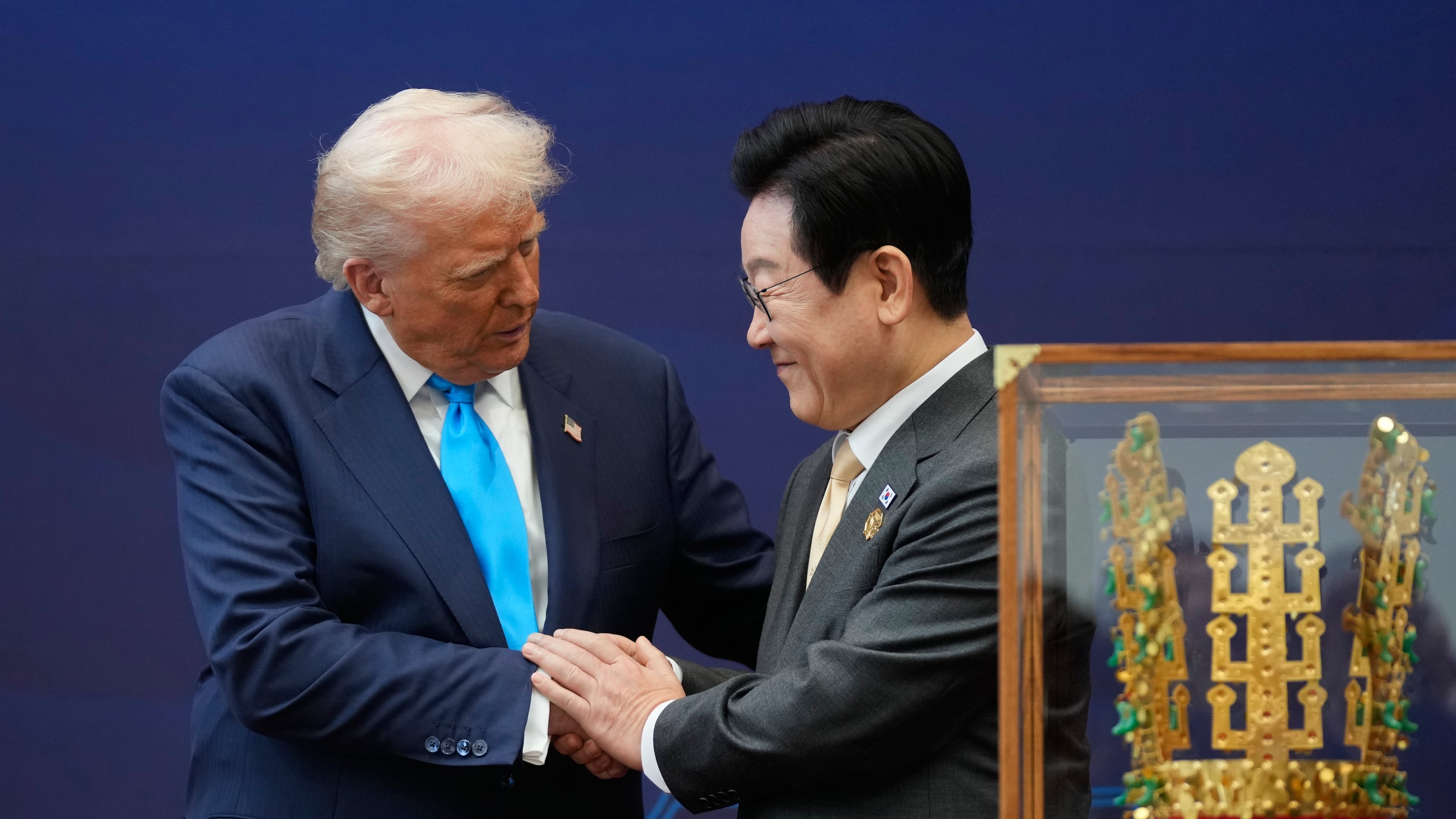 President Donald Trump shakes hands with South Korean President Lee Jae Myung as they attend a high honor ceremony at the Gyeongju National Museum in Gyoeongju, South Korea, Wednesday, Oct. 29, 2025. (AP Photo/Mark Schiefelbein)