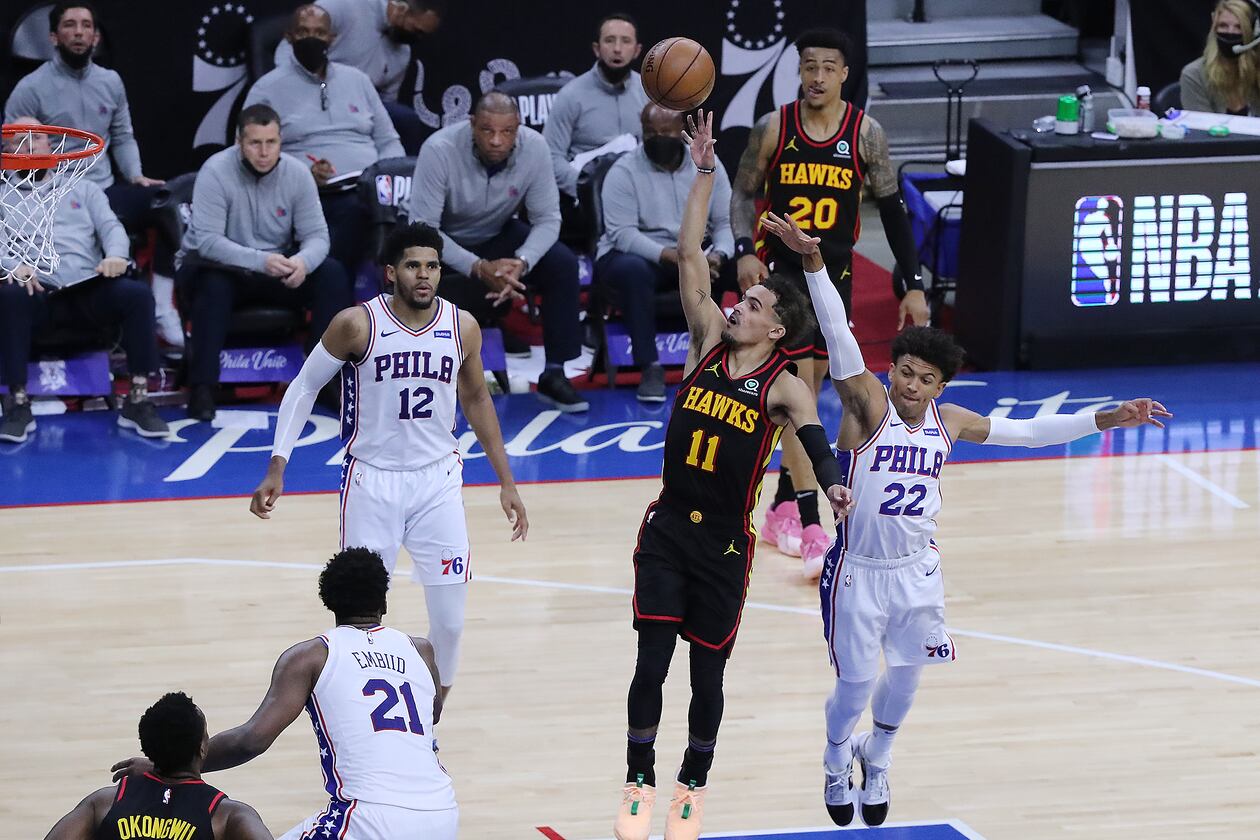 Hawks guard Trae Young drops in a floater for two points against the Philadelphia 76ers at the end of the third quarter of Game 7 of the Eastern Conference semifinals Sunday, June 20, 2021, in Philadelphia. (Curtis Compton / Curtis.Compton@ajc.com)
