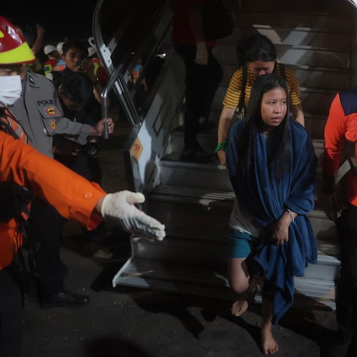 Survivors of a ferry fire arrive at Tanjung Perak Port in Surabaya, East Java, Indonesia, Monday, Aug. 3, 2026. (AP Photo/Trisnadi)