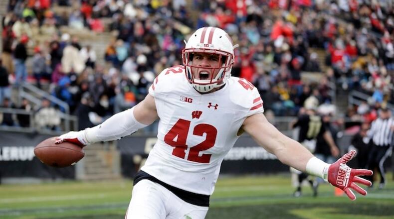 This Nov. 19, 2016, file photo shows Wisconsin linebacker T.J. Watt (42) celebrating after returning an interception for a touchdown during the first half of an NCAA college football game against the Purdue in West Lafayette, Ind. (AP Photo/Michael Conroy, File)