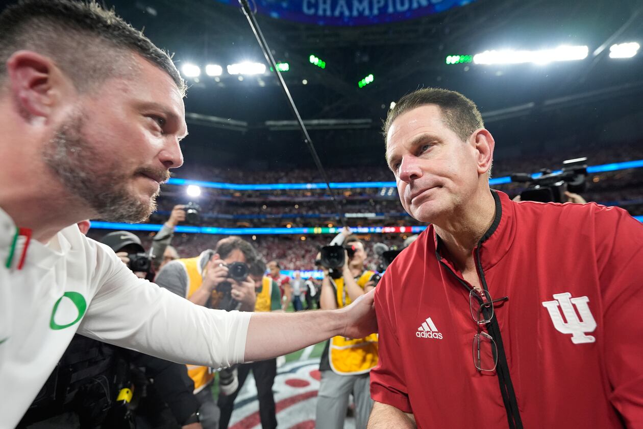 A Fox analyst says Indiana head coach Curt Cignetti (right) has done more with less than Georgia's head coach and should be ranked higher. (Brynn Anderson/AP)