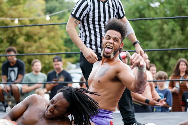 Stunt Marshall and DJ Smoke react after winning their wrestling match at New Realm Brewing on Sunday, August 31, 2025, in Atlanta. Miguel Martinez/AJC)