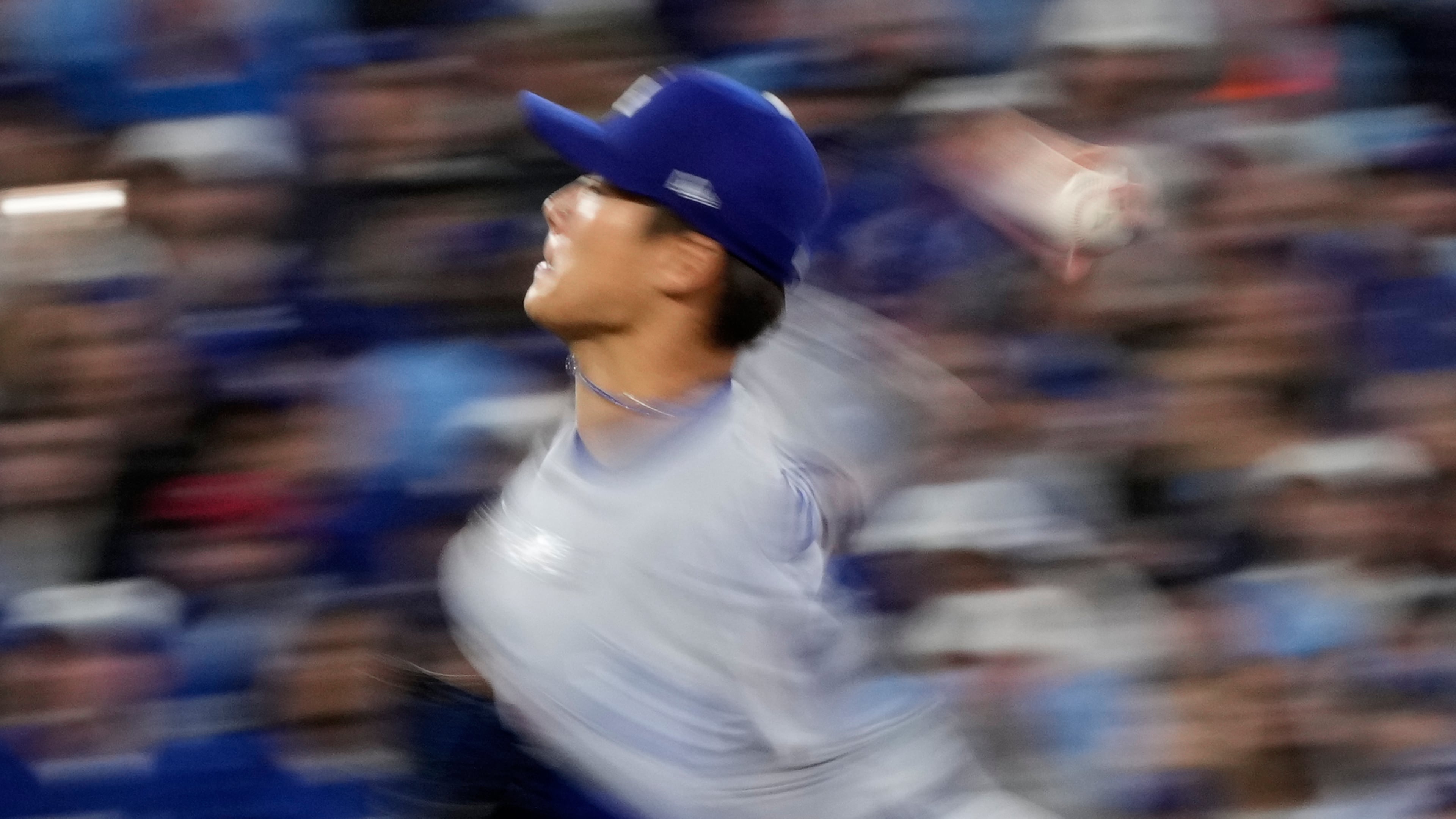 Los Angeles Dodgers pitcher Yoshinobu Yamamoto throws against the Toronto Blue Jays during the second inning in Game 2 of baseball's World Series, Saturday, Oct. 25, 2025, in Toronto. (AP Photo/Brynn Anderson)