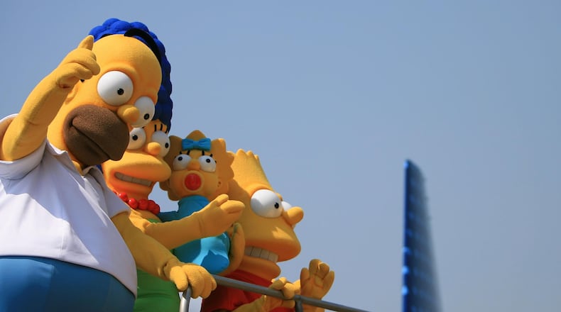 BURBANK, CA - JULY 17: Actors dressed as the characters from the long-running television cartoon series "The Simpson" pose at the unveiling of Jet Blue's "Simpson's" themed airplane at the Burbank Airport on July 17, 2007 in Burbank, California. (Photo by Michael Buckner/Getty Images)