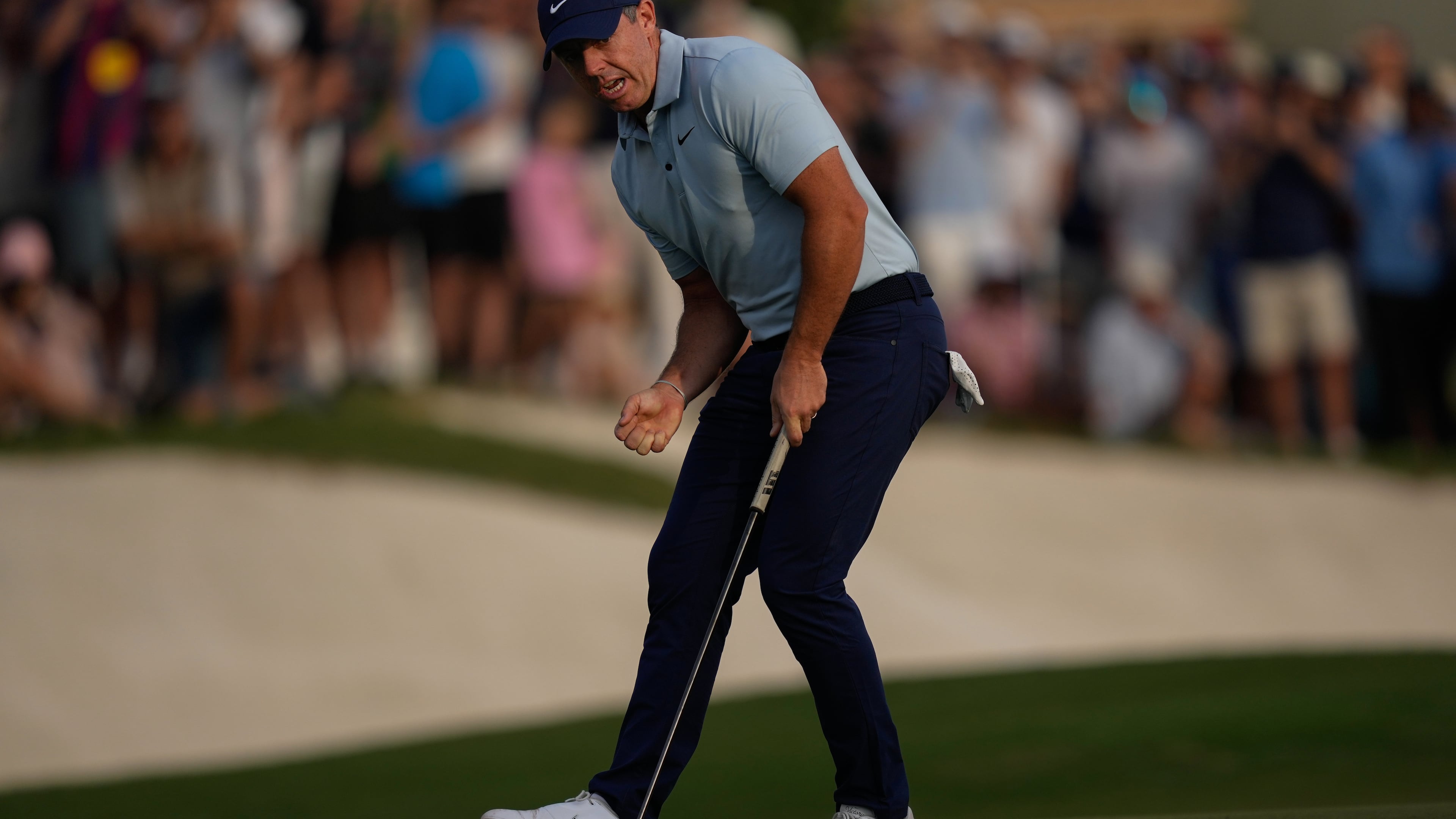 Rory McIlroy of Northern Ireland reacts after putting on the 18th hole to earn play-off with Matt Fitzpatrick of England during the final round of World Tour Golf Championship in Dubai, United Arab Emirates, Sunday, Nov. 16, 2025. (AP Photo/Altaf Qadri)