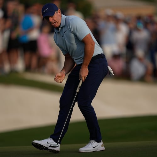 Rory McIlroy of Northern Ireland reacts after putting on the 18th hole to earn play-off with Matt Fitzpatrick of England during the final round of World Tour Golf Championship in Dubai, United Arab Emirates, Sunday, Nov. 16, 2025. (AP Photo/Altaf Qadri)