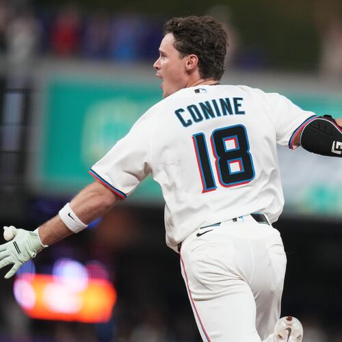 Miami Marlins' Griffin Conine (18) reacts after hitting a walk off single to score Heriberto Hernández and defeat the Philadelphia Phillies in the the ninth inning of a baseball game, Monday, July 27, 2026, in Miami. (AP Photo/Lynne Sladky)